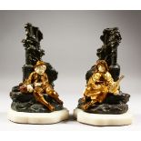 T. CAMIER, CIRCA 1920. A GOOD PAIR OF BRONZES, GILDED BRONZE AND IVORY FIGURES OF A YOUNG BOY AND