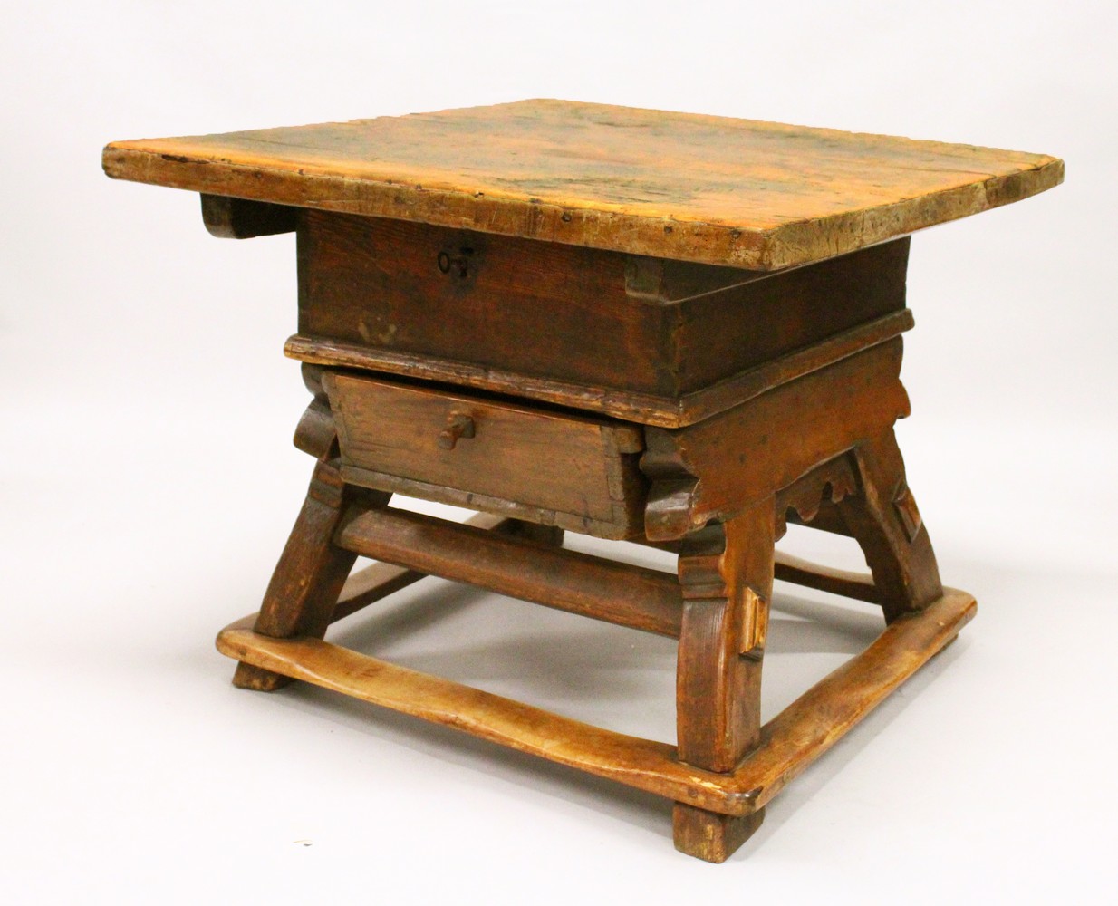 AN UNUSUAL EARLY 18TH CENTURY CONTINENTAL FRUITWOOD AND PINE RENT TABLE, with a sliding thick