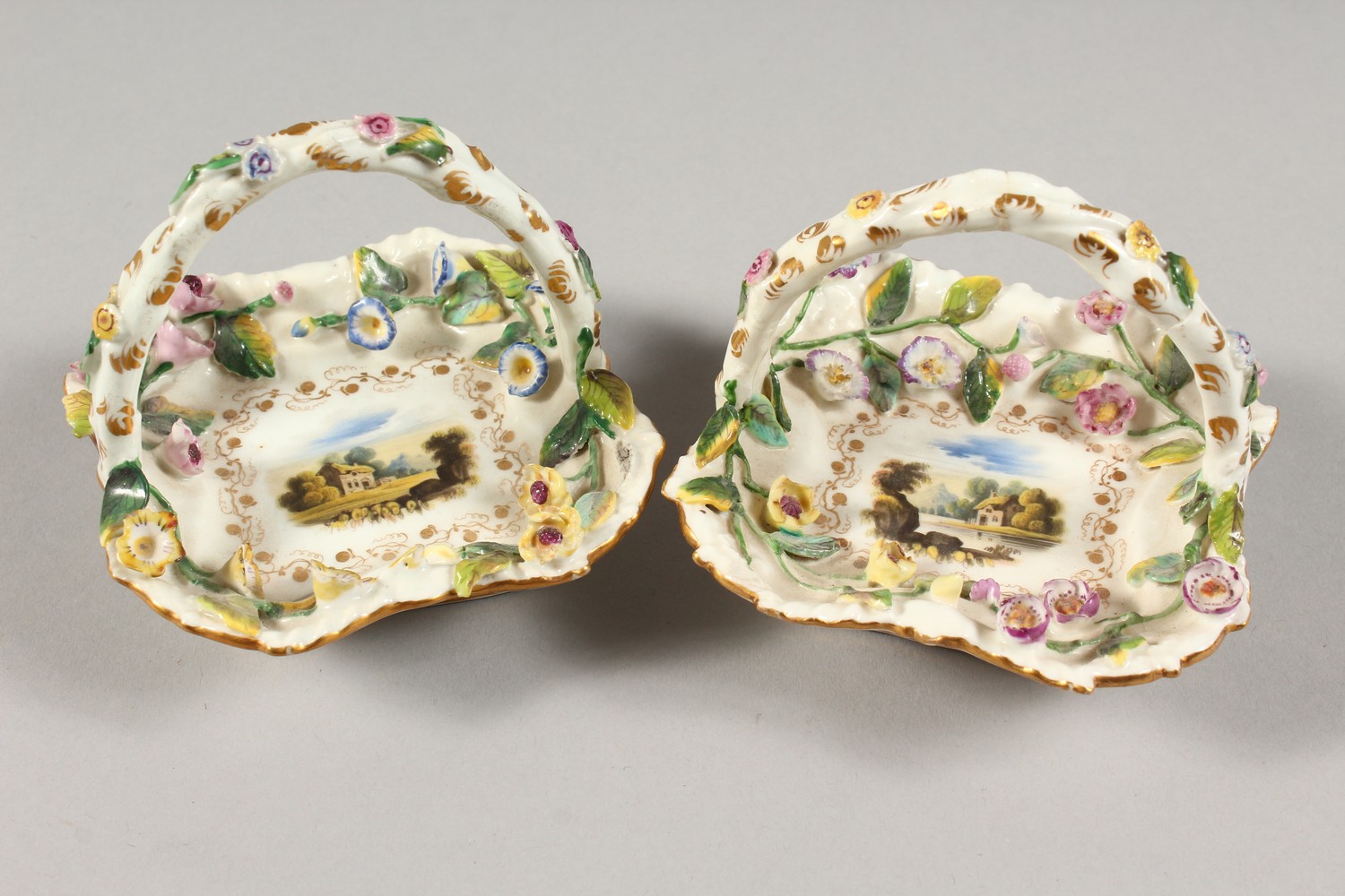 A SMALL PAIR OF ROCKINGHAM BASKETS, the centres painted with a cottage and encrusted with flowers. - Image 2 of 9