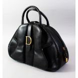 A CHRISTAN DIOR BLACK LEATHER BAG with dust bag.