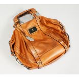 A BROWN LEATHER BAG.