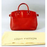 A LOUIS VUITTON RED LEATHER BAG with dust cover.