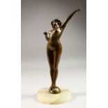 PAUL PHILIPPE (1890-1930) FRENCH. A STANDING BRONZE NUDE "The Awakening" on a circular onyx base.