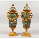 A GOOD PAIR OF LOUIS XV1TH DESIGN VEINED MARBLE CASSOLETTES AND COVERS with satyr masks, fruiting