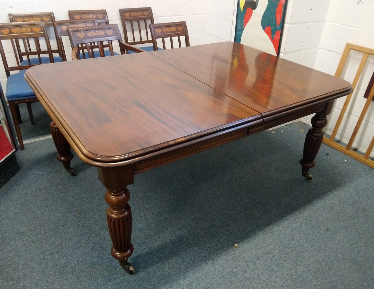 A GOOD VICTORIAN STYLE MAHOGANY EXTENDING DINING TABLE, by Frank Hudson & Son, with three leaves, on