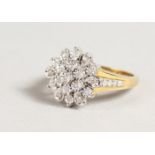 A 9CT GOLD DIAMOND FLOWERHEAD CLUSTER RING.