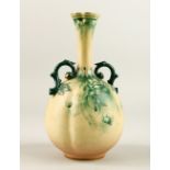 A HADLEY WORCESTER TWO HANDLED BULBOUS VASE painted with wall flowers. 8.5ins high.