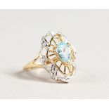 A 9CT GOLD BLUE TOPAZ AND DIAMOND RING.
