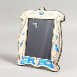 A SILVER AND BLUE ENAMEL KINGFISHER PHOTOGRAPH FRAME. 8ins x 6ins.