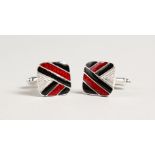 A PAIR OF SILVER RED AND BLACK CUFFLINKS.