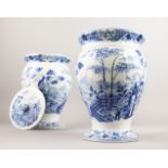 A GOOD PAIR OF WEDGWOOD BLUE AND WHITE VASES WITH LIDS with a Chinese landscape pattern. Impressed