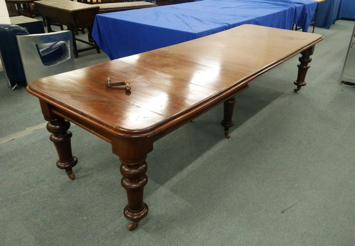 A VICTORIAN MAHOGANY EXTENDING DINING TABLE, with three leaves, on six turned legs, 9' 8" long x