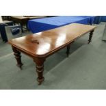 A VICTORIAN MAHOGANY EXTENDING DINING TABLE, with three leaves, on six turned legs, 9' 8" long x