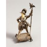 A GOOD SMALL GERMAN SILVER AND IVORY FIGURE OF A MAN AT ARMS holding a staff with ivory face. Import
