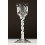 A GEORGIAN WINE GLASS, the bowl engraved with fruiting vines, with white air twist stem. 5.75ins