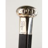 A SILVER HANDLED WALKING CANE, initial P. London hallmarks. 3ft long.