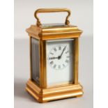 A PLAIN MINIATURE BRASS CARRIAGE CLOCK. 3ins high,