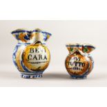 TWO ITALIAN TIN GLAZE JUGS "BEVI CARA" and "BEVI TUTTO". 7ins and 5ins high.