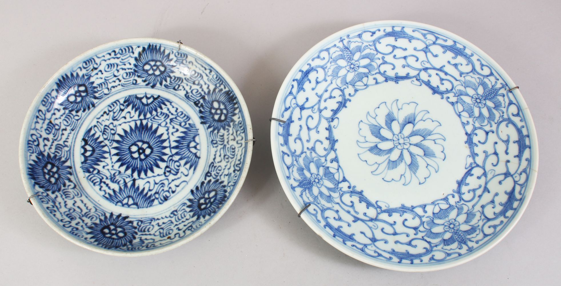 TWO 19TH / 20TH CENTURY CHINESE BLUE & WHOITE PORCELAIN PLATES, each with formal scrolling foliage