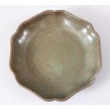 A GOOD CHINESE MOULDED RU WARE PORCELAIN DISH, 13.2cm diameter.