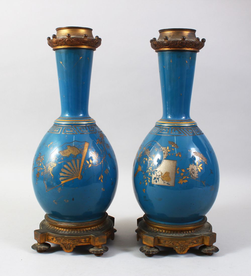 A PAIR OF 19TH CENTURY CHINESE PORCELAIN BOTTLE VASES / LAMP BASES, the ground with gilded