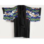 A GOOD CHINESE 19TH / 20TH CENTURY PAINTED SILK ROBE, the black ground robe with painted decorated