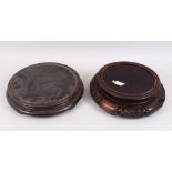 TWO CHINESE CARVED HARDWOOD CIRCULAR STANDS, for vases with a diameter of 9.5 & 7.5" diameter. (2)