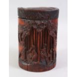 A 19TH / 20TH CENTURY CHINESE CARVED BAMBOO BRUSH POT AND COVER, carved with figures amongst