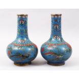 A GOOD PAIR OF LATE 19TH CENTURY CHINESE CLOISONNE BOTTLE VASES, the blue ground with floral