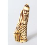 A JAPANESE EDOI PERIOD CARVED STAG ANTLER NETSUKE OF GENKEI SENNIN, the sennin stood holding a