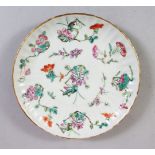 A GOOD 19TH CENTURY CHINESE FAMILLE ROSE FLUTED SAUCER DISH, decorated with scenes of flora, the