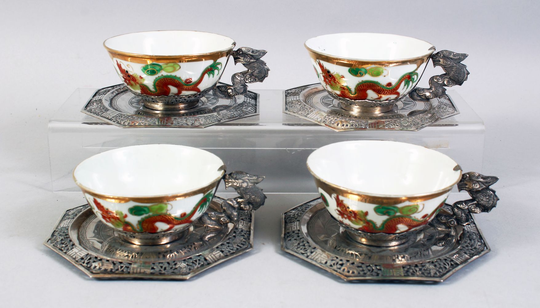 A SET OF FOUR 20TH CENTURY CHINESE FAMILLE ROSE PORCELAIN AND SILVER MOUNTED CUPS & SAUCERS, the