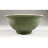 A CHINESE MING DYNASTY LONGQUAN CELADON STONEWARE BOWL, with an everted rim, the interior centre