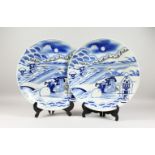 A LARGE PAIR OF JAPANESE BLUE & WHITE SNOW SCENE PORCELIAN CHARGERS, the chargers decorated the same