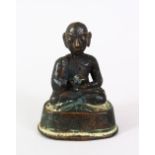 A 17TH / 18TH CENTURY BURMESE BRONZE FIGURE OF BUDDHA, in a seated position, 4.5cm wide.