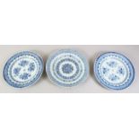 THREE 18TH / 19TH CENTURY CHINESE BLUE & WHITE PORCELAIN PLATES, each with floral decoration and a