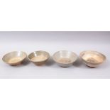 FOUR EARLY CHINESE POTTERY GLAZED BOWLS, some glazed, some parcially glazed, various sized but
