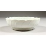 A CHINESE BLANC DE CHINE PORCELAIN CIRCULAR BRUSH WASHER, the dish with moulded leaf decoration,