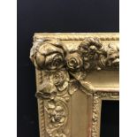 19th Century French School. A Gilt Composition Frame, with floral corners, 24" x 19.5" (rebate), and