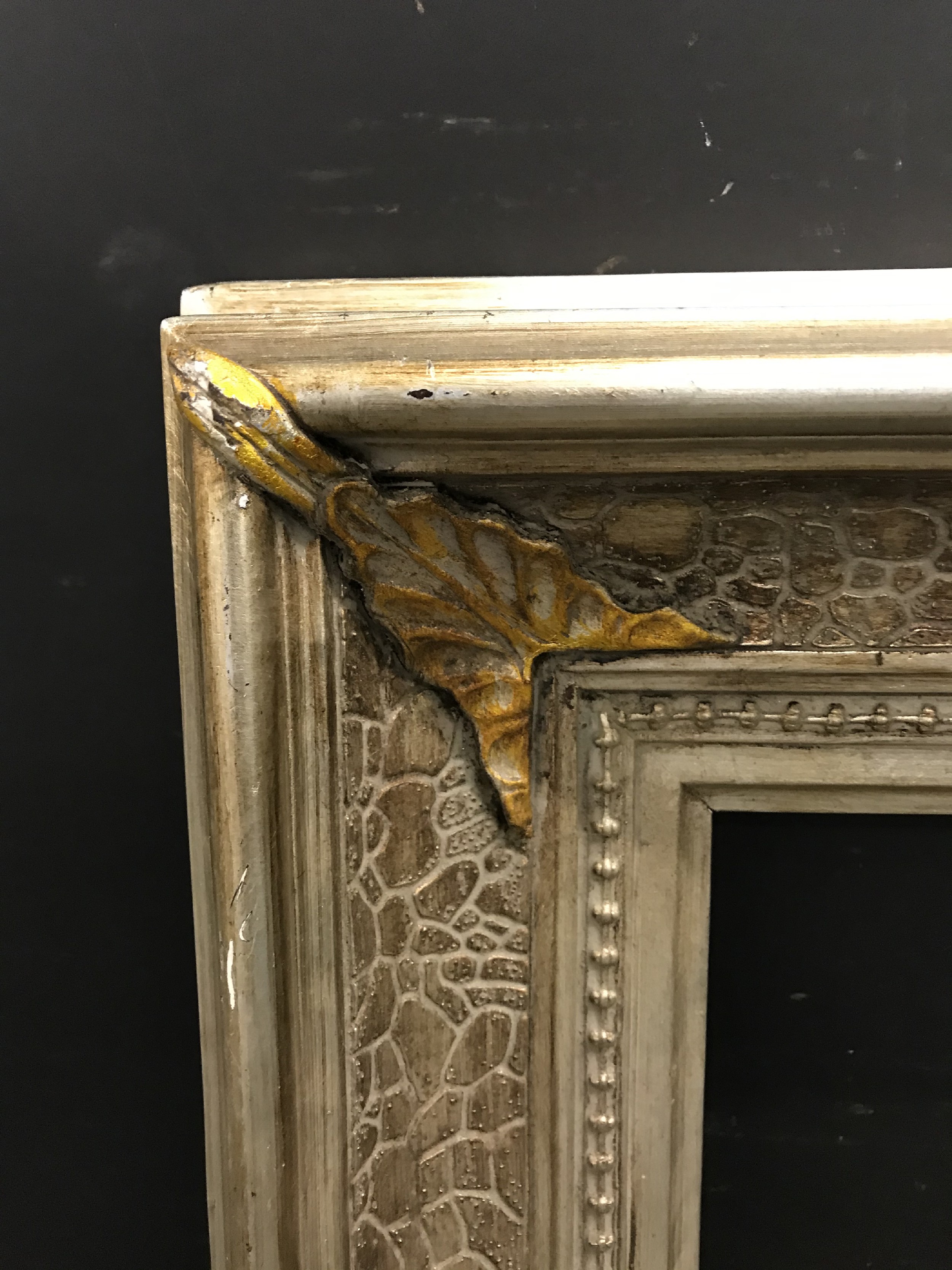 20th Century American School. A Silver and Gilt Composition Frame, 24" x 20" (rebate).