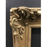 20th Century English School. A Gilt Composition Frame, with swept and pierced centres and corners,