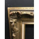 20th Century Continental School. A Gilt Composition Frame, with swept corners and fabric slip, 39.5"