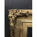 19th Century English School. A Gilt Composition Frame, with swept corners, and inset glass, 14.25" x