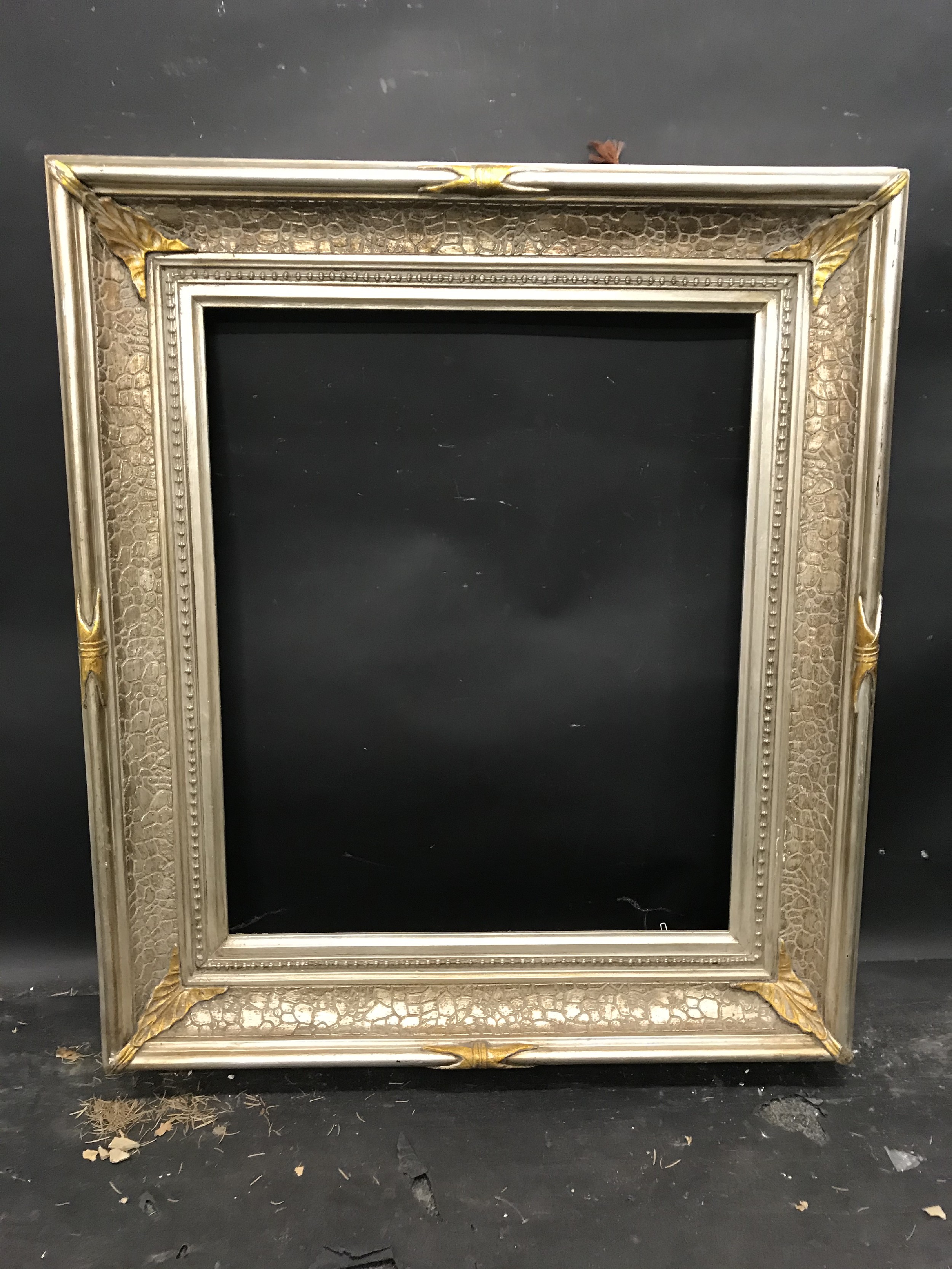 20th Century American School. A Silver and Gilt Composition Frame, 24" x 20" (rebate). - Image 2 of 3