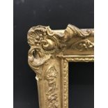 19th Century French School. A Gilt Composition Frame, with swept corners, 18.25" x 15" (rebate),