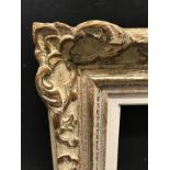 20th Century English School. A Gilt and Painted Composition Frame, with swept centres and corners,