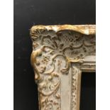 20th Century English School. A Gilt and Painted Frame, with swept centres and corners, 18" x 15" (