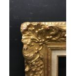 20th Century French School. A Gilt Composition Frame, with swept centres and corners, and a fabric