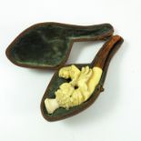 MEERSCHAUM PIPE MODELLED AS CHILD MOUNTED ON LION, WITH FITTED CASE