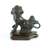 CHINESE CAST BRONZE DOG OF FO ON POLISHED WOOD STAND, APPROX. 13.5 cm H. OVERALL, PROVENANCE